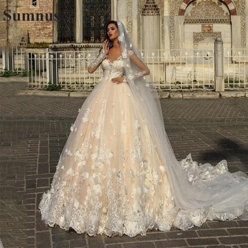 Sumnus Lusury Ball Gown Champagne Wedding Dresses with White 3D Flowers Illusion Sheer Long Sleeves Arabic Bridal Gowns