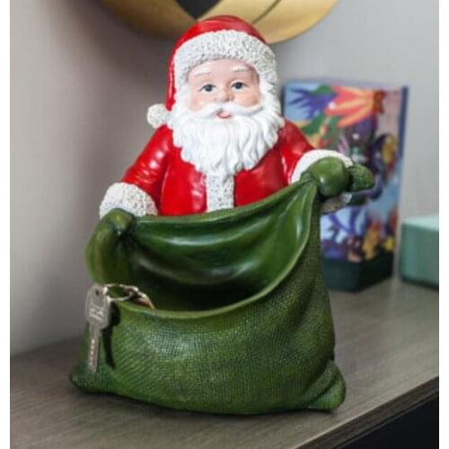 FIGURE SANTA CLAUS RECEIVE AND PUT ON A TEA TABLE IN THE LIVING ROOM DISPLAY ROOM WINDOW DECORATION SCENE TO DECORATE CHRISTMAS