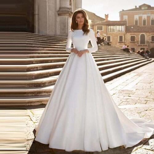 2021 Fashion Illusion O Neck Long Sleeve Satin Chapel Train Wedding Dresses