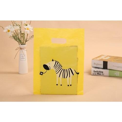 100psc Handbag clothing plastic handbag bag hand bag four finger bag clothing store bag