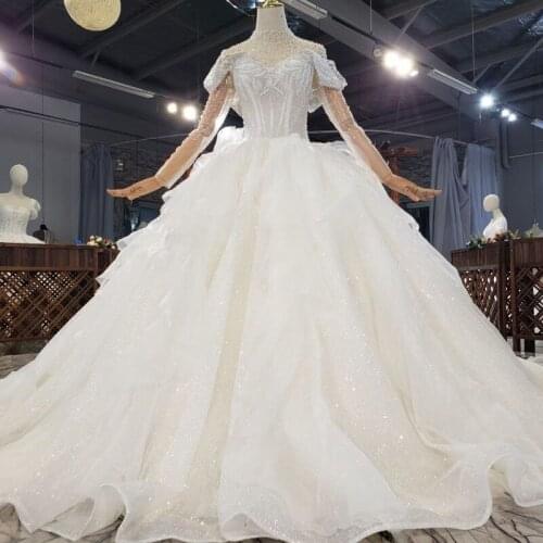 Luxury Rhinestones Beaded Wedding Dresses 2021 Long Sleeves Ball Gown Bridal Dress Sparkle Sequins Tulle Marrige Dress Vestidos