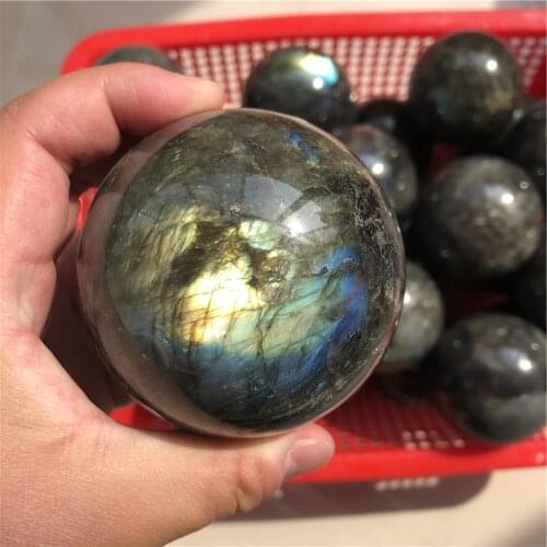 Natural Labradorite crystal ball, with different light, the surface will produce different brilliant colors
