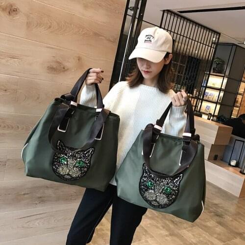 Korean short distance travel bag female cartoon Sequin hand luggage bag Korean large capacity one shoulder travel bag