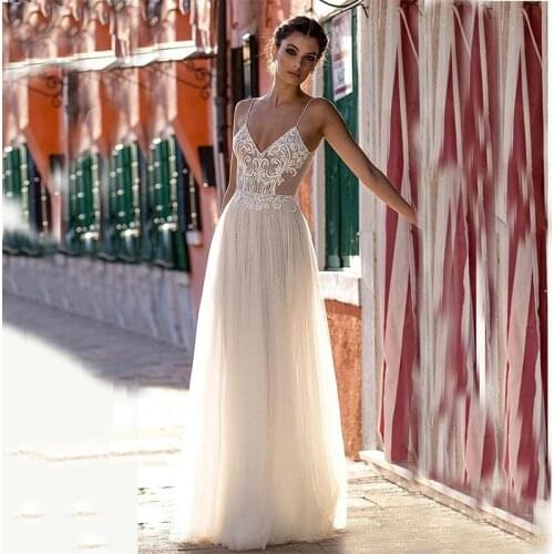 Sexy Backless Champagne Bridal Dresses 2021 Lace Beaded Bohemian Wedding Gowns Dots Tulle Floor Length Spaghetti Straps Gelinlik