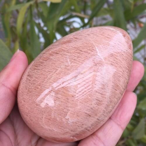 Natural orange moonstone palm, beauty, purification of negative energy