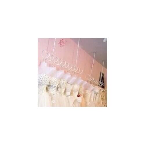 Spring condole hang clothing display shelf on the wall side is hanging clothes rack Black and white spiral hanging shelf