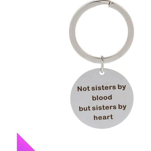 Keychain stainless steel disc pendant engraved with "Not sisters by blood but sisters by heart