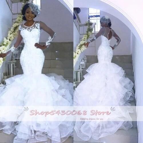 2020 Sexy Sheer See Through African Wedding Dresses Long Sleeves Open Back Tiered Skirts Nigerian Bridal Wedding Gowns