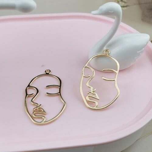 MuhNa 10pcs Hollow Out Human Face Charms Gold Color Exaggerated Earrings Pendant DIY Decor For Keychains Jewelry Accessories