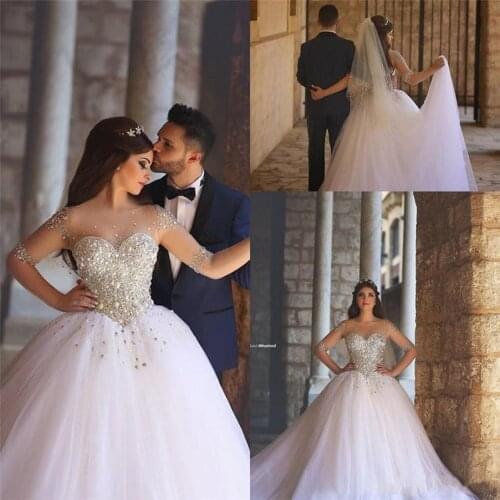 Illusion Long Sleeves Bling Bling Crystals Ball Gown Chapel Train Bridal Gown New Luxury Hand Beading Wedding Dresses