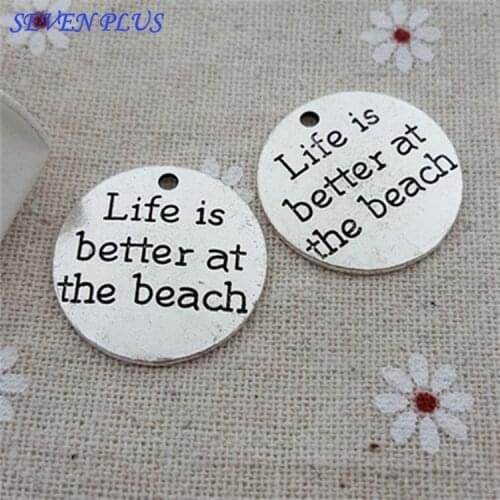 Top Quality 20 Pcs/lot Diameter 23mm Life is better at the beach Antique Silver plated Round Disc Quote Message Charms Pendant