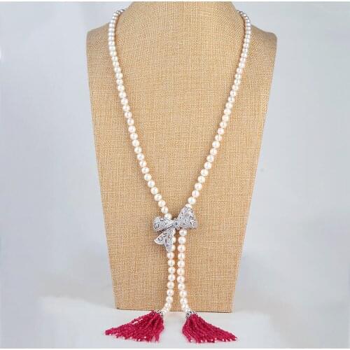 42" White Pearl Bowknot Tassel Necklace CZ Pendant