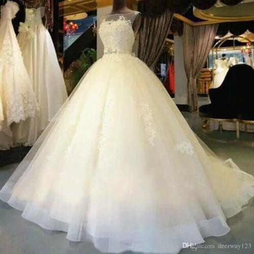 Beautiful A-Line Sleeveless Tulle Wedding Dresses Illusion Neckline Appliques Elegnat Bridal Gowns Custom Made Court Train 2019