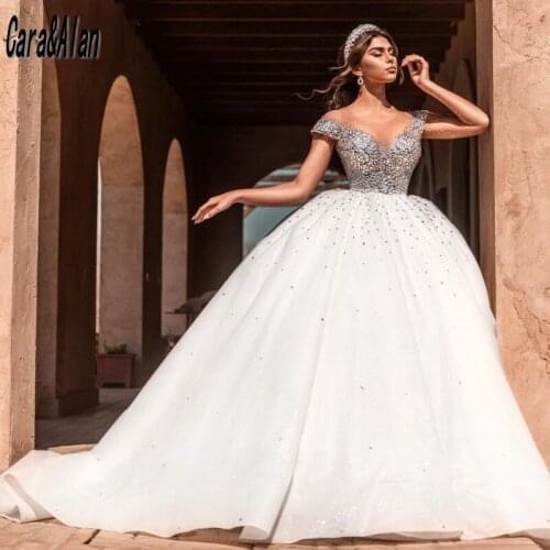 Luxury robe de mariée princesse Crystal Wedding Dresses 2021 Sheer Neck Arabic Dubai Bridal Gowns Backless Cap Sleeve