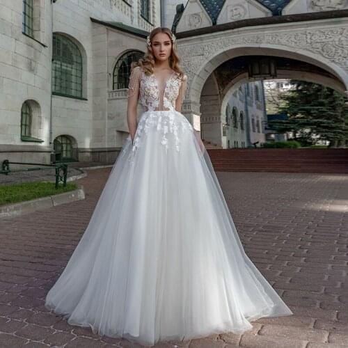 Stunning Sheer Wedding Dresses 2021 A Line Applique Beading Tassel Tulle Sweep Train See Through Back Beach Bridal Gowns