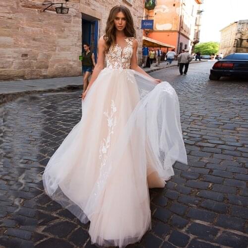 Charming Tulle A-Line Wedding Dresses 2021 Sheer O-Neck Lace Appliques Sleeveless Backless Button Sweep Train Bridal Gown