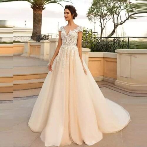 Sheer O-neck Appliqued Flower Crystal Tulle Court Train Boho Wedding Dresses With Cap Sleeve Bridal Gowns robe de mariee 2020