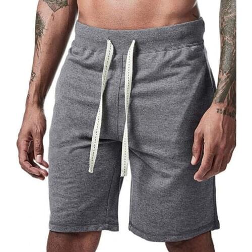 Summer mens shorts loose pockets all matching solid color drawstring soft and versatile fitness shorts beach commuting shorts