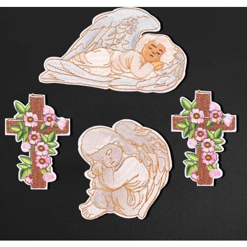 White angel wings, computer embroidery, cross, flowers, embroidered chapters, decorated with holes in clothes, ironed with iron