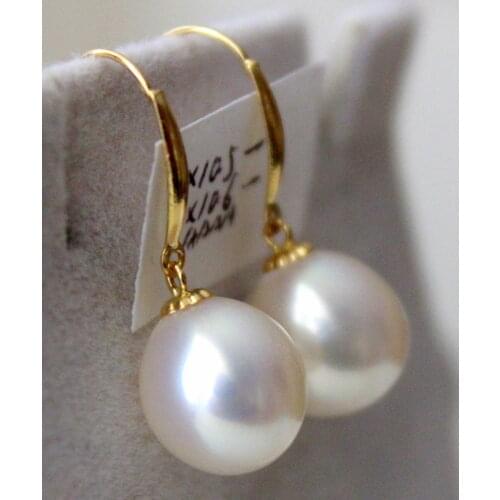 Stunninga pair of 12-13mm natural baroque white pearl earring14k