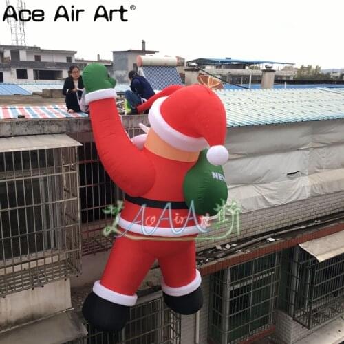 Hot selling 4m H Christmas inflatable decorations,inflatable Christmas Climbing Santa with logo for promotion
