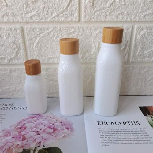 Luxury Cosmetic Packaging Opal White Porcelain Glass Pump Spray Bottl 40ml 100ml 120ml with Bamboo Screw Cap