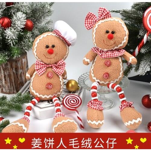 Christmas decorations plush gingerbread man ornaments shop window shopping mall scene layout dress up a pair of gingerbread