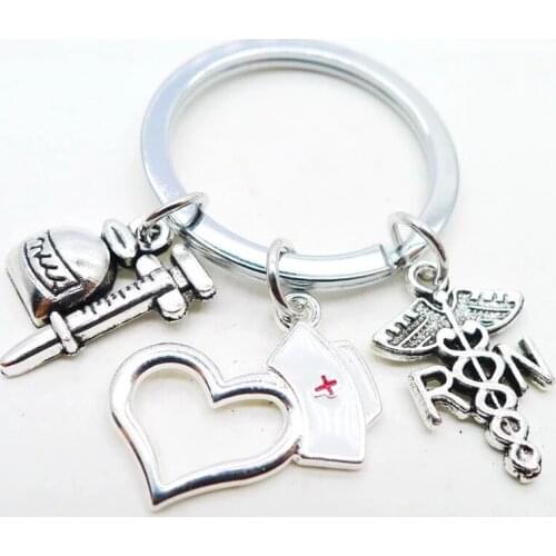 Creative Alloy Keychain Cute Dripping Oil Nurse Hat Spirit Snake Ancient Silver Keychain Promotional Gift Pendant