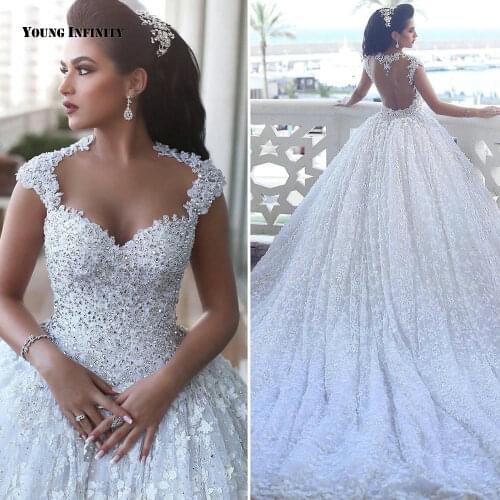 Sexy Ball Gown Wedding Dresses 2021 Sleeveless Bridal Gown Backless Sweetheart Chaple Train Beading Lace White Plus Size Bride
