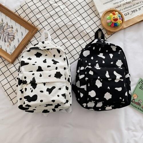 Cow Milk Print Backpack for Women Canvas Large Capacity Students Girls Daily Shoulder School Bag Rucksack