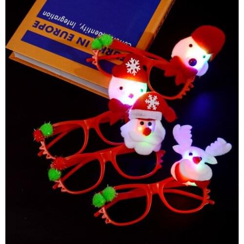 Children and adults dress up in glasses for Christmas, shine Santa Claus glasses, festive mood decorations, small gifts