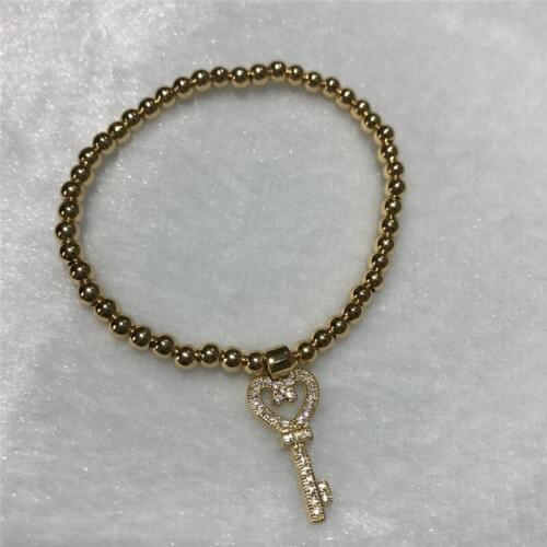 Wholesale Beautiful popular good quality inlay zirco key 4 mm round bead bracelet Elastic rope