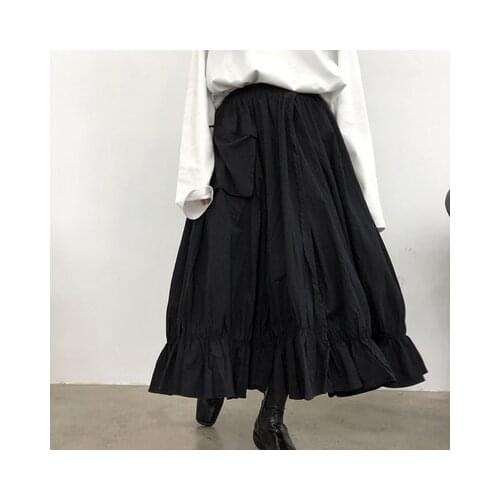 Long black skirt with irregular high waist pleats in Dark Yamamoto skirt with large pockets