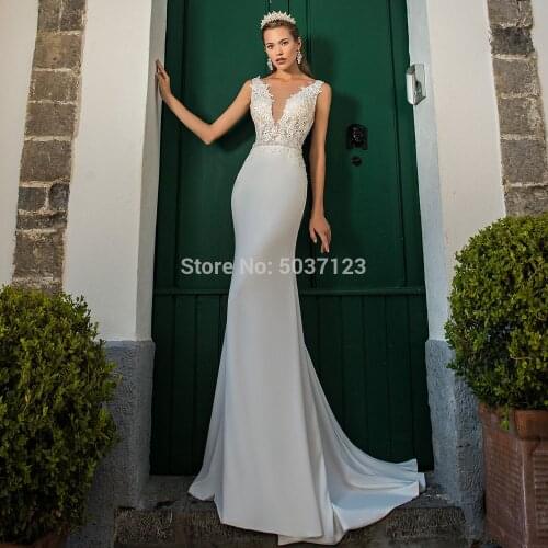Glamorous Mermaid Wedding Dresses Deep V Neck Sleeveless Lace Appliques Backless Vestido De Noiva Sweep Train Bridal Gown 2020