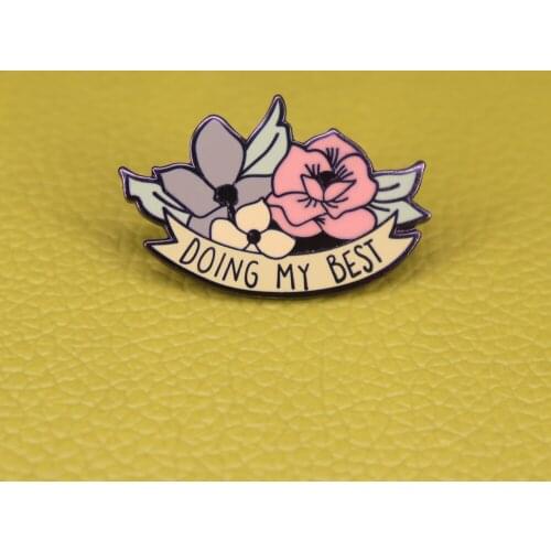 A floral motivational pin badge that reminds you that you are doing your best