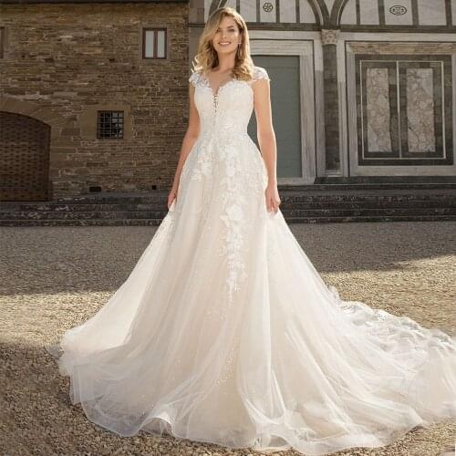 Gorgeous Wedding Dresses 2021 Sheer Neck Cap Sleeve A-Line Lace Appliques Button Tulle Bridal Gown Sweep Train Vestidos De Noiva