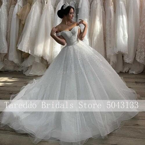 Luxury Pearls Beading Wedding Dresses 2021 Sexy Sweetheart Chapel Train Backless Long Formal White Dress For Brides Plus Size