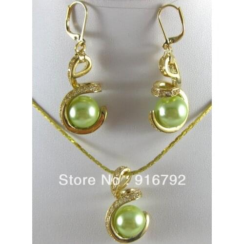 Free shipping ******18GP fashion natural shell pearl pendant + Sea green earrings