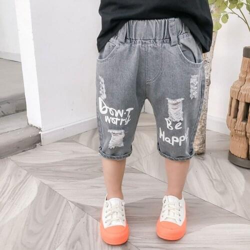 Childrens ripped denim shorts 2021 summer new boys and girls print five-point pants little boys pants
