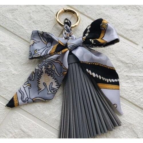 1pcs New High Quality Fashion Scarves Key holder Ribbon Bowknot Exquisite Leather Tassels Keychains Women Bag Charm Pendant