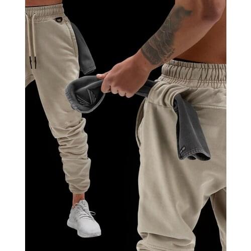 Sports mens trousers European and American leisure cotton fitness hanging towel trousers training elastic rope trousers trouser
