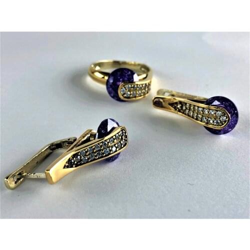 Silvery purple round stone ring On top of the elegant 17 white stone earrings On top of it 2 rings with 17 elegant white stones