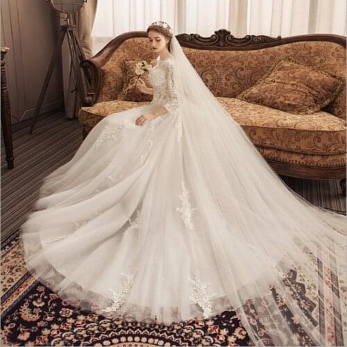Elegant Wedding Dress O-Neck Long Sleeves Tulle Applique sweep Button backless A-Line Bridal Ball Gown