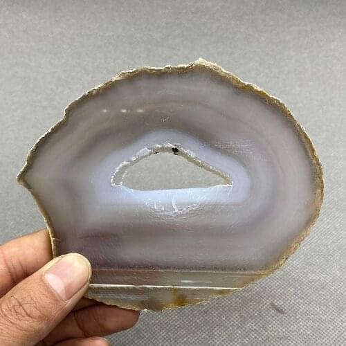 Natural agate slice polished ore specimen with crystal hole