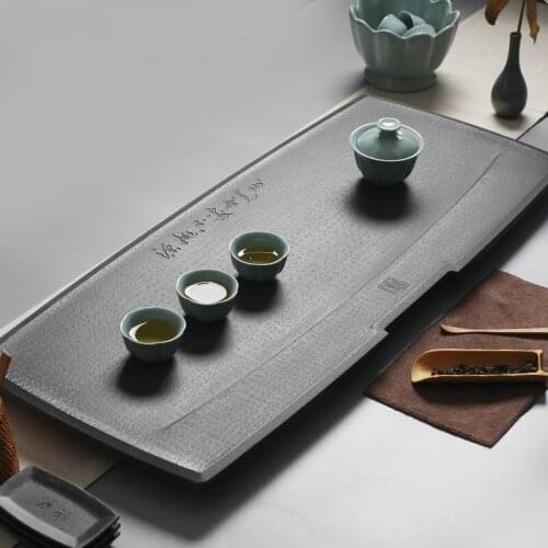 Engraved Chinese words weighted black stone tea table water draining copper outlet pipe heavy tea boat 25kg for kungfu tea set