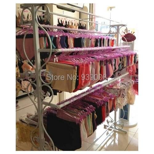 Wrought iron hangers in bra wearing lingerie display console lingerie store shelves underwear clothing rack shelf package mail
