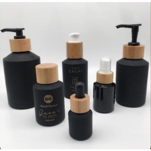 100ml 60ml glass spray bottle CBD bottle Bamboo Cosmetic Packaging bamboo pump bottle Frosted black body lotion shampoo bottle