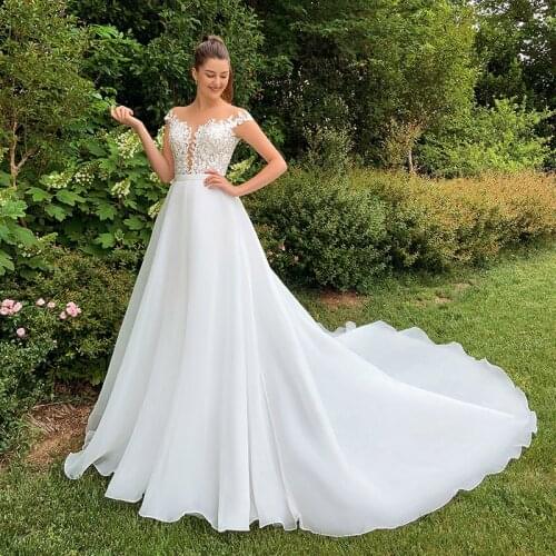 Glam Scoop Cap Sleeve Beach Wedding Dresses 2021 Appliques Illusion Back A-line Court Train Bridal Gowns Robes De Mariage