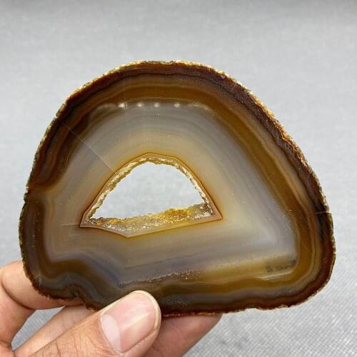 Natural agate slice polished ore specimen with crystal hole