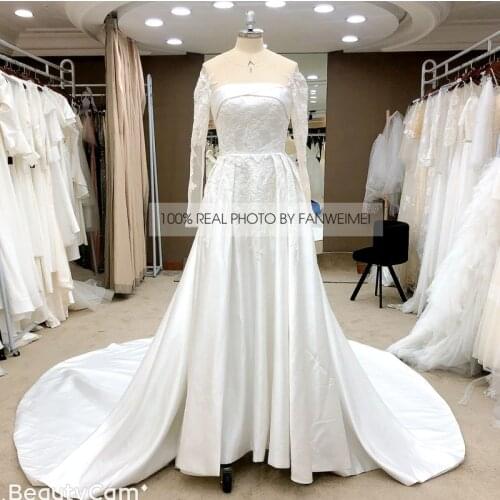 Floor Length Lace Appliques Sweep Train Long Sleeve V-Neck Wedding Dress Backless Backless Bridal Gowns Stunning High Quality